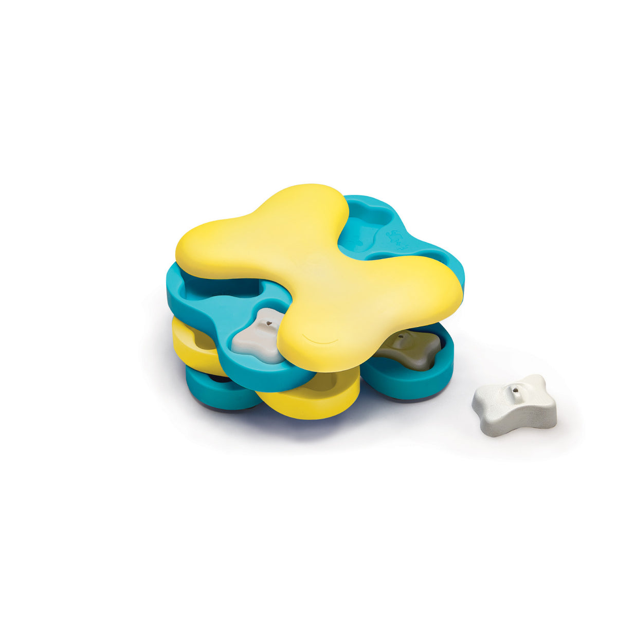 Nina Ottosson Dog Tornado Level 2 puzzle, yellow and teal rotating layers with a white bone peg