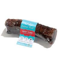 The Pet Project Natural Treats Beef Tube, a single dried beef trachea with its paper label band