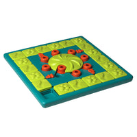 Nina Ottosson Multipuzzle Level 4 dog puzzle, green and teal board with red pegs in a rosette layout