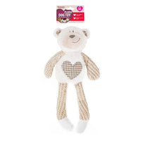 Rosewood Benjamin Bear cream plush dog toy with a heart chest patch, on its card