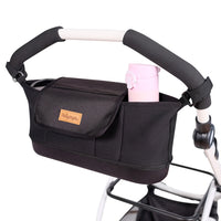Ibiyaya pet pram organiser in black fitted to a stroller handlebar with a drink bottle in the pocket