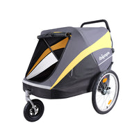 Ibiyaya Hercules tri-cycle pet stroller in grey and yellow, side view with its large spoked wheel