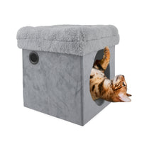 A bengal cat climbing out of the All for Paws AFP LAM two-in-one grey cat house with plush top