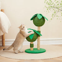A cat pawing at the Petsbelle Bliss cat tree, a green sisal tree-shaped post with leaf platforms
