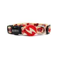 Dashi Tribes dog collar in cream with a red cartoon tribal print, red bolt tag and D-ring