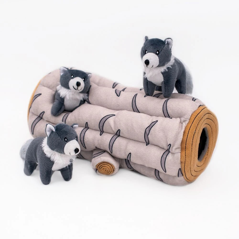 Zippy Paws Burrow plush dog toy: a snowy log den with three squeaky arctic wolves