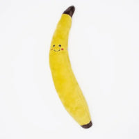 Zippy Paws Jigglerz plush banana dog toy with a smiling face, on a white background