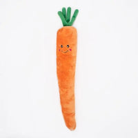 Zippy Paws Jigglerz plush carrot dog toy with a smiling face and green top, on white