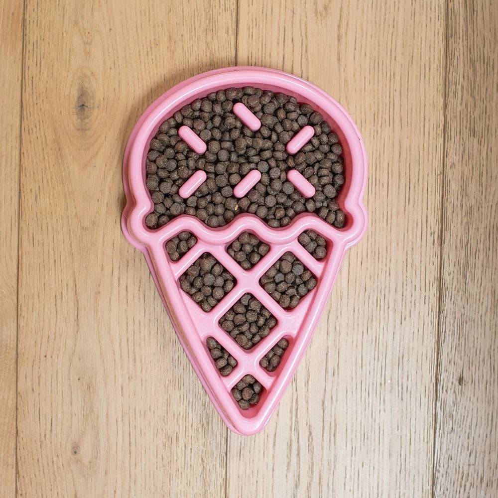 Zippy Paws ice cream shaped slow feeder bowl filled with kibble on floorboards