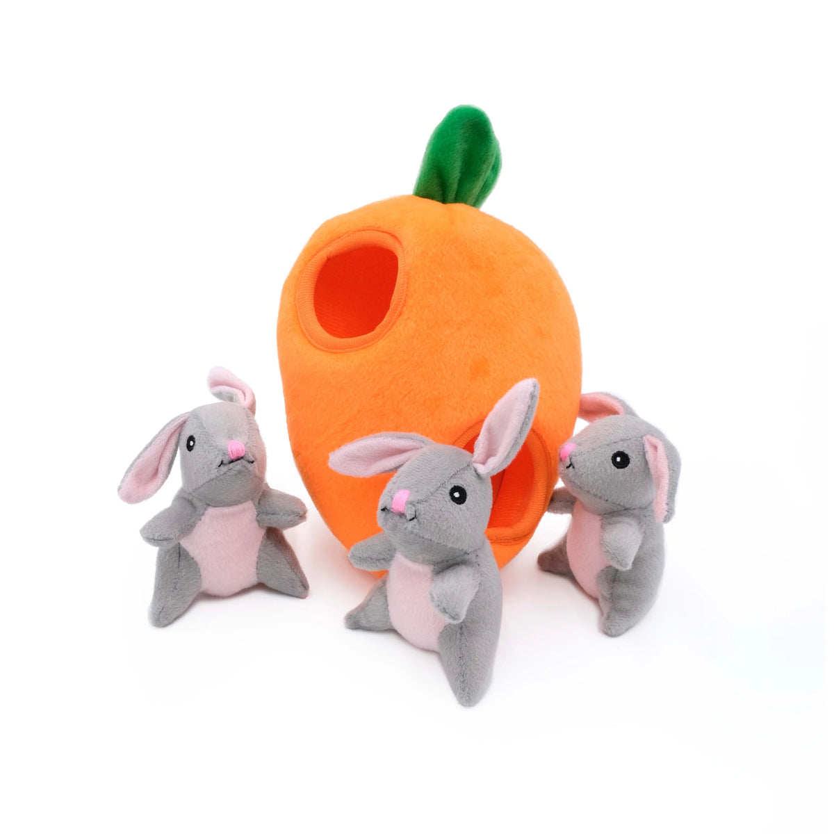 Zippy Paws Burrow plush dog toy: an orange carrot with three squeaky grey bunnies