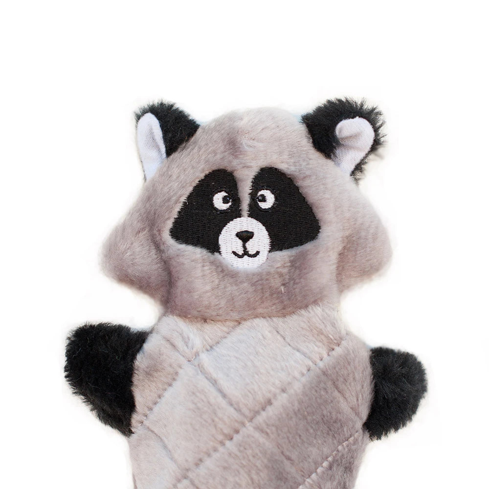 Close-up of the masked face and paws of a Zippy Paws Jigglerz plush raccoon dog toy