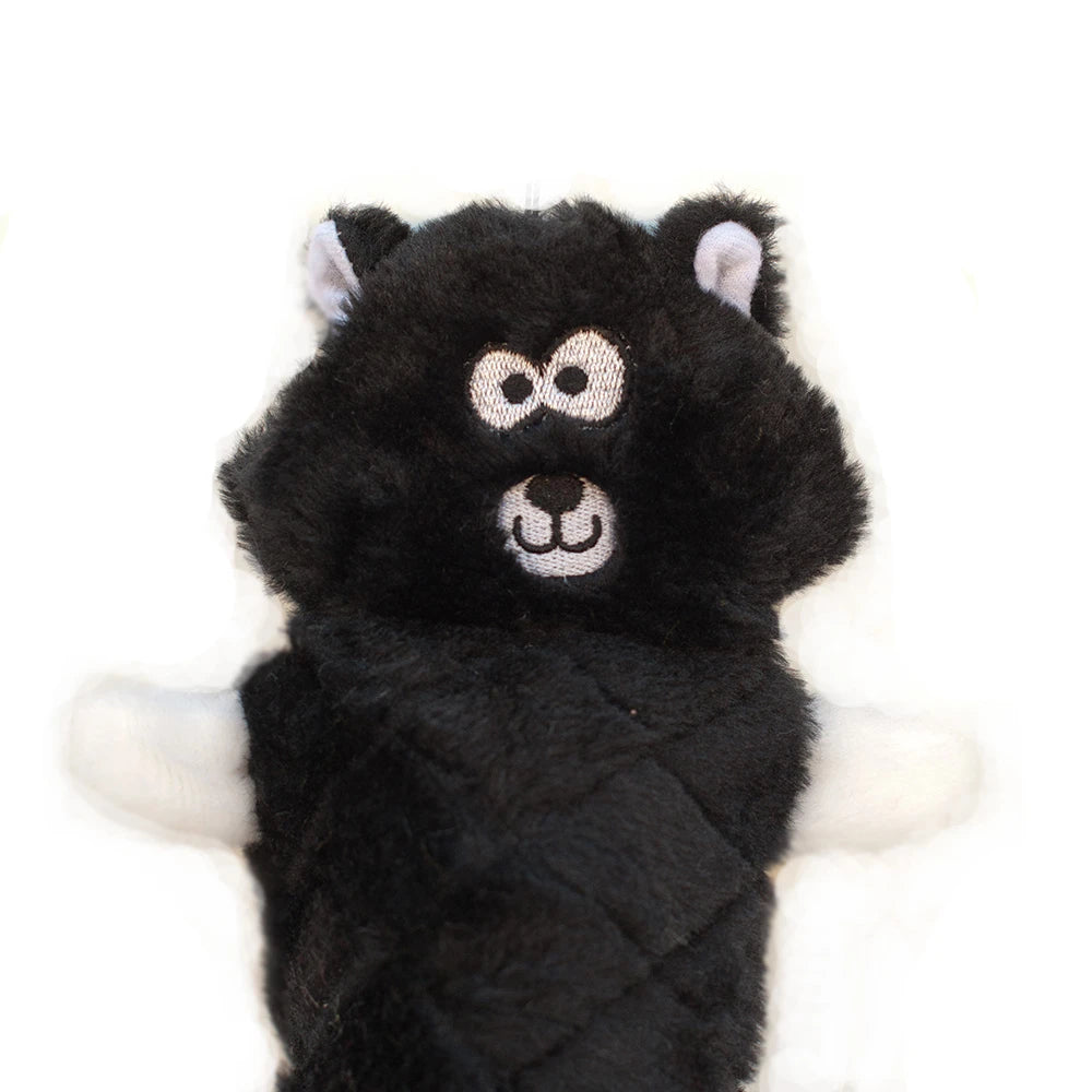 Close-up of the head and paws of a Zippy Paws Jigglerz plush skunk dog toy