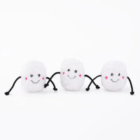 Three Zippy Paws Miniz plush marshmallow dog toys with smiling faces, on white