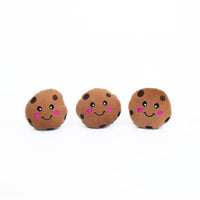 Three small Zippy Paws Miniz plush cookie dog toys with smiling faces, on white