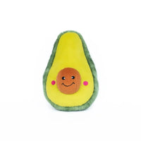Zippy Paws NomNomz plush dog toy shaped as an avocado half, on a white background