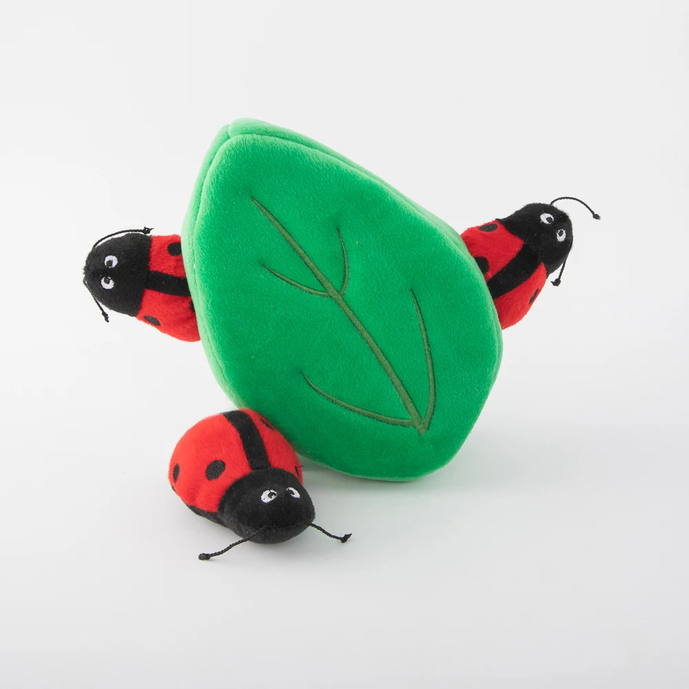 Zippy Paws Burrow plush dog toy: a green leaf with two squeaky ladybugs