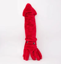 Zippy Paws Jigglerz plush red squid dog toy with dangling tentacles, on a white background