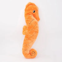 Zippy Paws Jigglerz plush seahorse dog toy in orange, shown on a white background