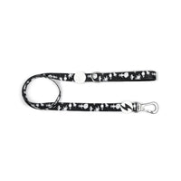 Dashi Astronaut dog lead in black with a white space print, bolt tag and silver trigger clip, on white