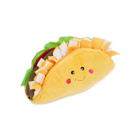 Zippy Paws NomNomz plush dog toy shaped as a taco with a smiling face, on white